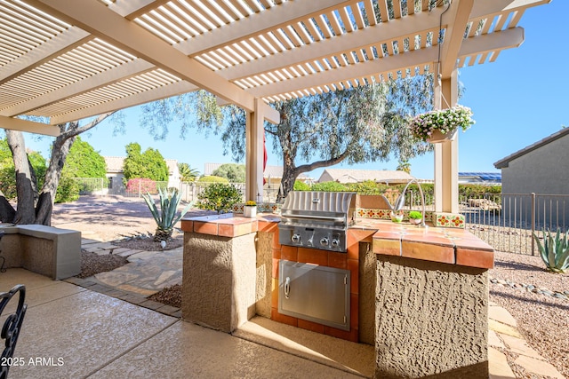 view of patio / terrace with an outdoor kitchen, area for grilling, and a pergola