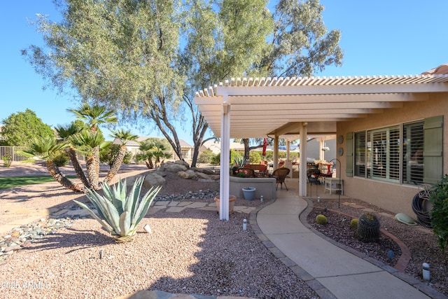 view of yard featuring a pergola and a patio