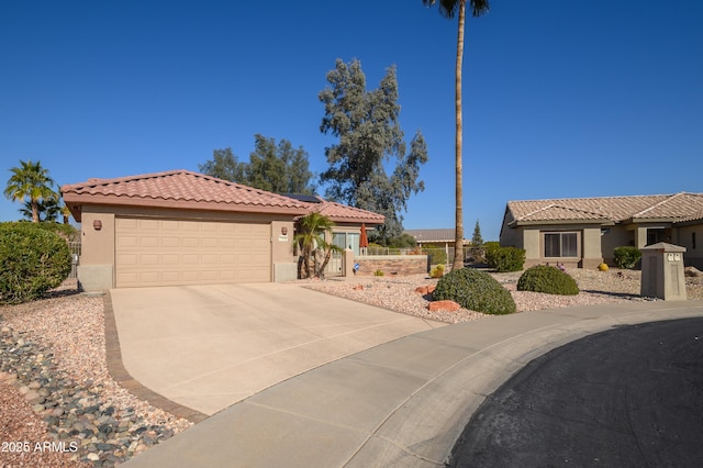 view of front of property with a garage and solar panels