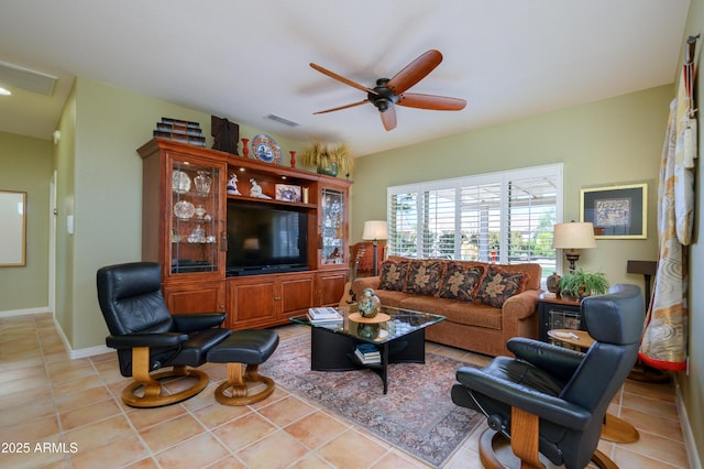 living room featuring light tile patterned floors and ceiling fan