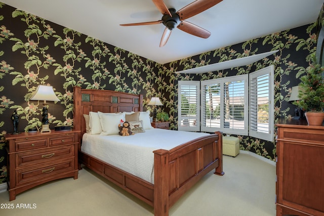 bedroom featuring light carpet and ceiling fan