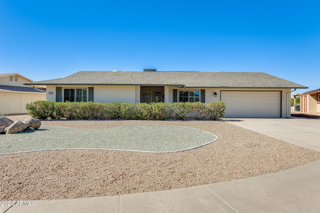 ranch-style home with a garage