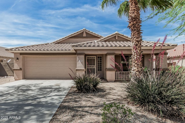708 E Mule Train Trl, San Tan Valley, AZ 85143 - view of front of house featuring a porch, a tile roof, a garage, concrete driveway, and stucco siding