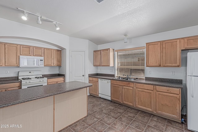 708 E Mule Train Trl, San Tan Valley, AZ 85143 - kitchen featuring dark countertops, a sink, white appliances, rail lighting, and dark tile patterned floors