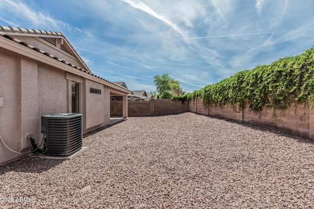 708 E Mule Train Trl, San Tan Valley, AZ 85143 - view of yard with a fenced backyard, a patio area, and cooling unit