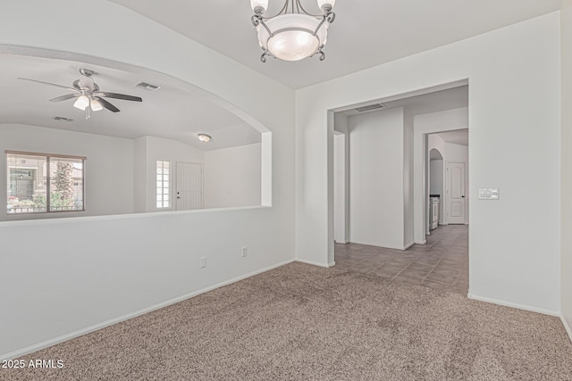 708 E Mule Train Trl, San Tan Valley, AZ 85143 - carpeted spare room with arched walkways, a ceiling fan, visible vents, and baseboards
