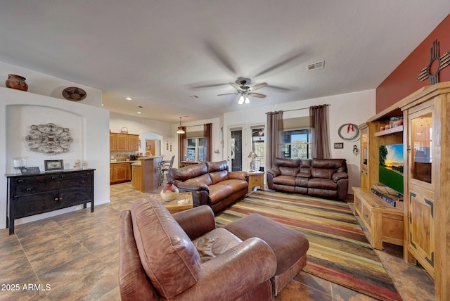 living room featuring ceiling fan