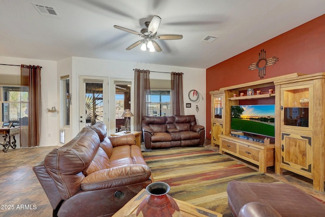 living room with plenty of natural light and ceiling fan