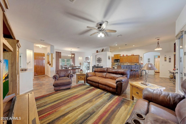 tiled living room featuring ceiling fan