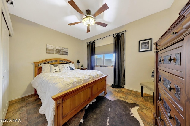 bedroom featuring ceiling fan and a closet