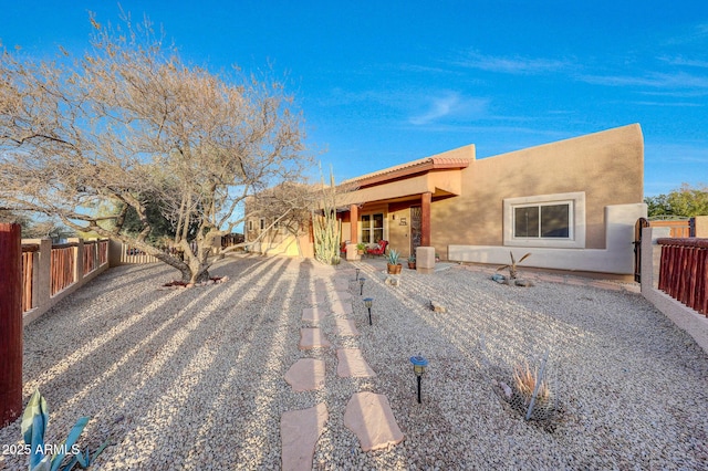 back of property with a patio area