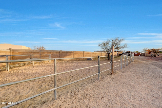 view of yard with a rural view