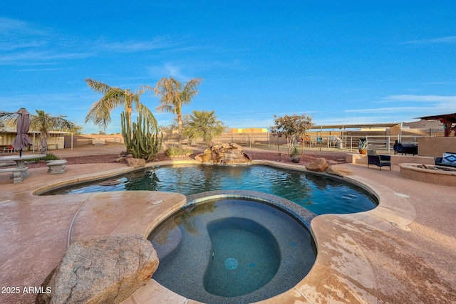 view of swimming pool featuring a grill, an in ground hot tub, and a patio