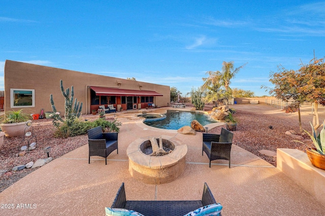 view of swimming pool with an in ground hot tub, an outdoor fire pit, and a patio area