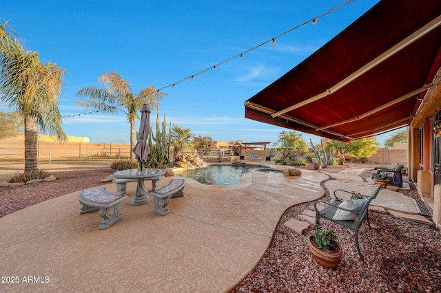 view of patio featuring a fenced in pool