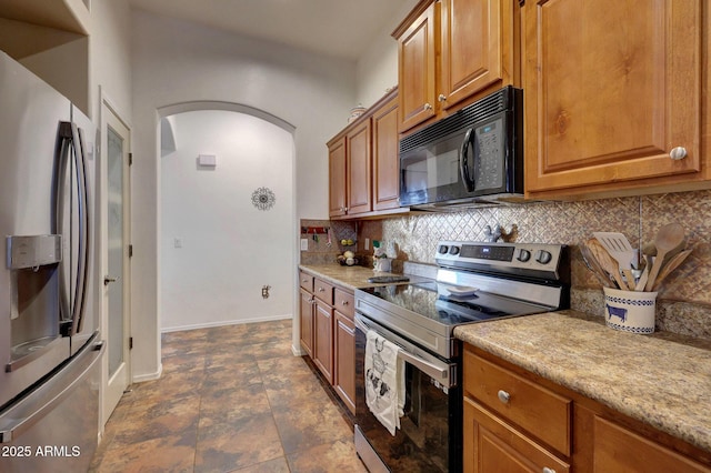 kitchen featuring tasteful backsplash and appliances with stainless steel finishes