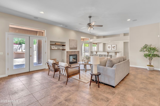 7524 E Leland Cir, Mesa, AZ 85207 - living area featuring a ceiling fan, french doors, recessed lighting, a fireplace, and baseboards