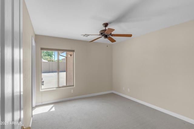 7524 E Leland Cir, Mesa, AZ 85207 - spare room featuring carpet flooring, a ceiling fan, and baseboards