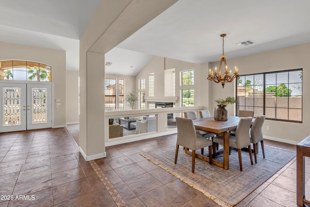 7524 E Leland Cir, Mesa, AZ 85207 - dining room featuring healthy amount of natural light, a chandelier, baseboards, and vaulted ceiling