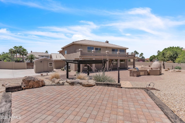 7524 E Leland Cir, Mesa, AZ 85207 - rear view of property with a shed, a fenced backyard, a patio area, and an outbuilding
