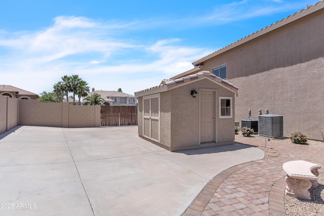 7524 E Leland Cir, Mesa, AZ 85207 - view of patio with fence, central AC, and an outbuilding