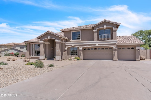 7524 E Leland Cir, Mesa, AZ 85207 - mediterranean / spanish-style house featuring stucco siding, a tile roof, driveway, and an attached garage