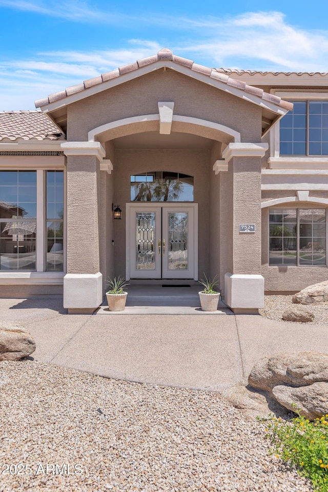 7524 E Leland Cir, Mesa, AZ 85207 - doorway to property with french doors, a tile roof, and stucco siding
