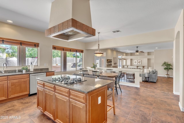7524 E Leland Cir, Mesa, AZ 85207 - kitchen featuring stainless steel dishwasher, a sink, gas cooktop, premium range hood, and ceiling fan
