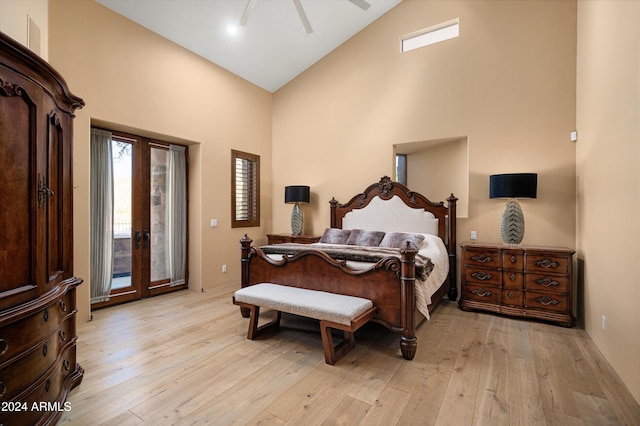 bedroom with high vaulted ceiling, access to outside, light hardwood / wood-style flooring, and ceiling fan