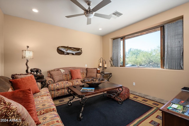 living room featuring carpet flooring and ceiling fan