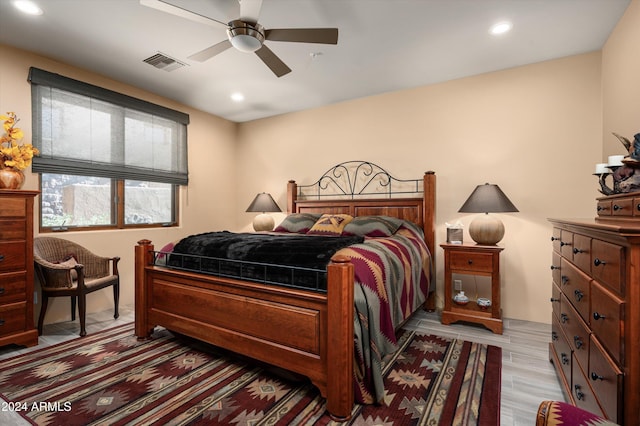 bedroom featuring ceiling fan and light hardwood / wood-style floors