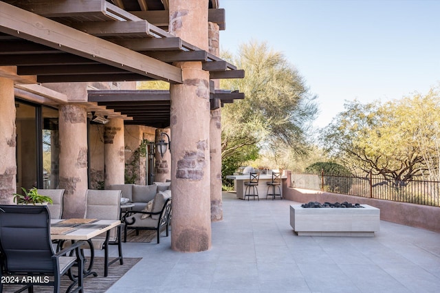 view of patio / terrace featuring an outdoor living space and an outdoor bar