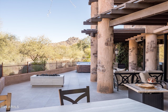 view of patio / terrace featuring a hot tub