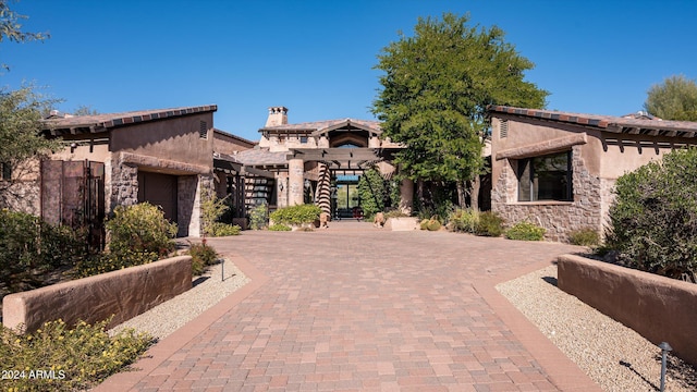 mediterranean / spanish home featuring a garage