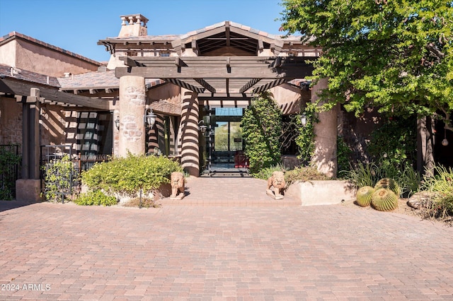 exterior space featuring a pergola