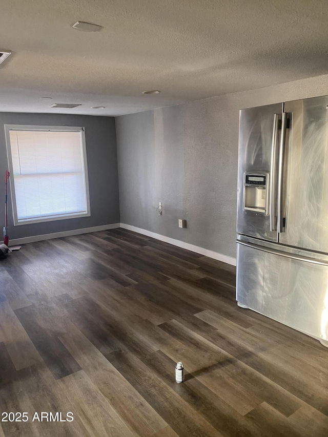 1217 E Hess Ave, Phoenix, AZ 85034 - spare room featuring dark wood finished floors and a textured ceiling