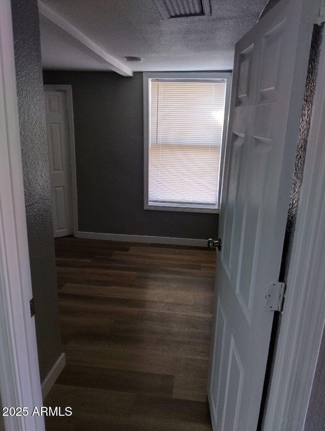 1217 E Hess Ave, Phoenix, AZ 85034 - corridor featuring a textured ceiling and dark wood finished floors