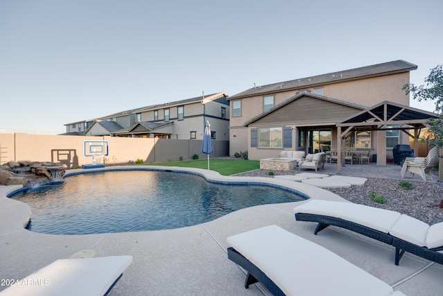 view of pool featuring a patio, a gazebo, and pool water feature