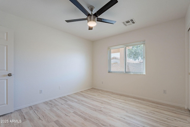 11805 W Sunnyside Dr, El Mirage, AZ 85335 - spare room with light wood-style floors, ceiling fan, and baseboards