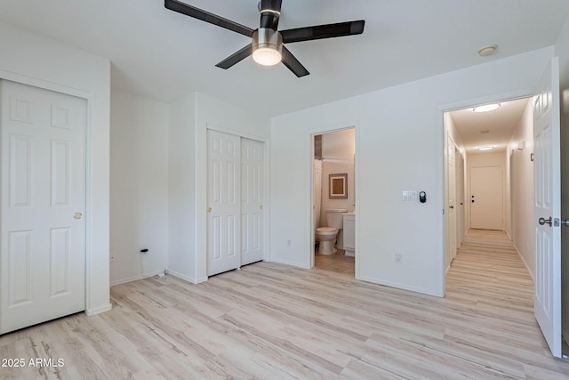 11805 W Sunnyside Dr, El Mirage, AZ 85335 - unfurnished bedroom featuring light wood-style flooring, ensuite bathroom, baseboards, and ceiling fan