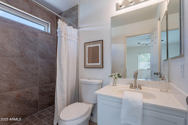 11805 W Sunnyside Dr, El Mirage, AZ 85335 - bathroom featuring toilet, a tile shower, and vanity