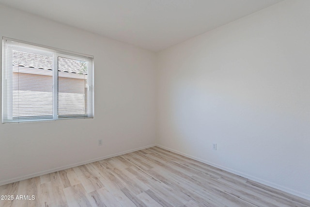 11805 W Sunnyside Dr, El Mirage, AZ 85335 - empty room featuring light wood-style flooring and baseboards