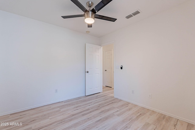 11805 W Sunnyside Dr, El Mirage, AZ 85335 - unfurnished room featuring light wood finished floors, a ceiling fan, and baseboards