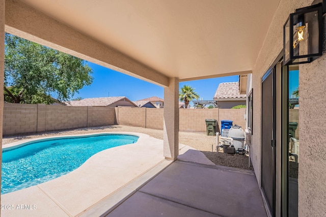 11805 W Sunnyside Dr, El Mirage, AZ 85335 - view of swimming pool featuring a patio area and a fenced backyard