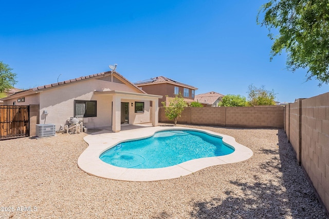 11805 W Sunnyside Dr, El Mirage, AZ 85335 - view of pool featuring central AC unit, a fenced backyard, and a patio