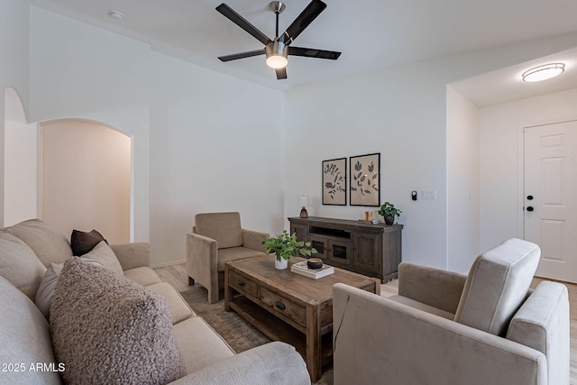 11805 W Sunnyside Dr, El Mirage, AZ 85335 - living area featuring ceiling fan, arched walkways, and wood finished floors