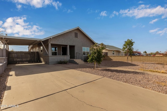 view of front of home featuring a carport