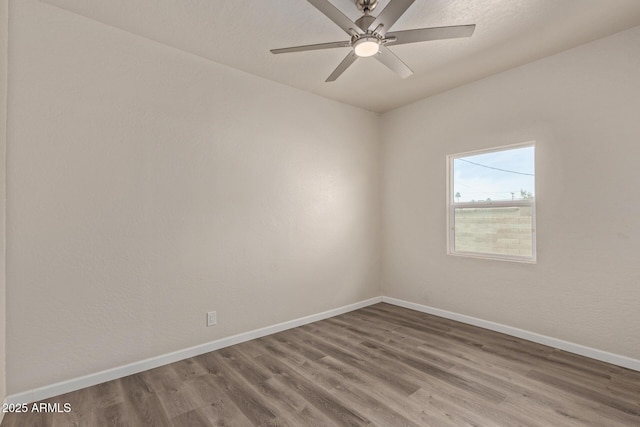 unfurnished room featuring hardwood / wood-style flooring and ceiling fan