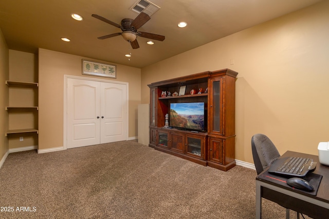 carpeted office featuring ceiling fan