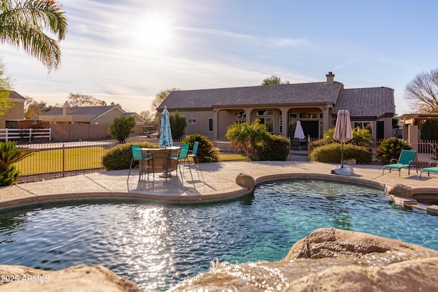 view of swimming pool with a patio area